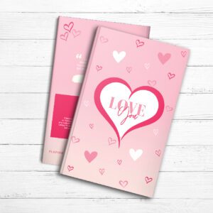 Two pink Love You Journals with the word love on them.